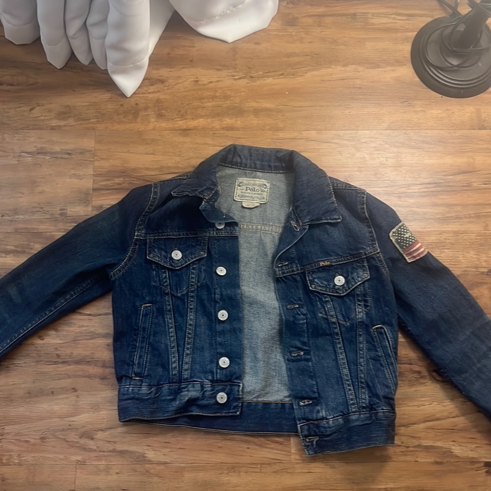 Boys wear a girl denim jacket the American flag is supposed to look like that